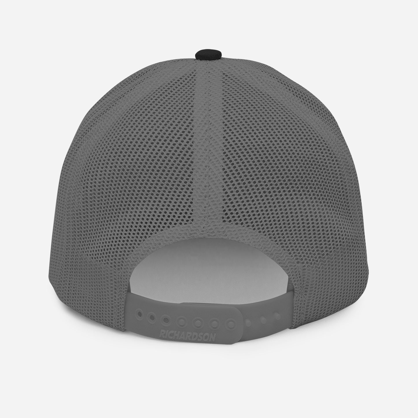 Back of a trucker hat with embroidered text 'I Smile for No One' in bold white lettering. Structured cap with mesh back and adjustable snapback.