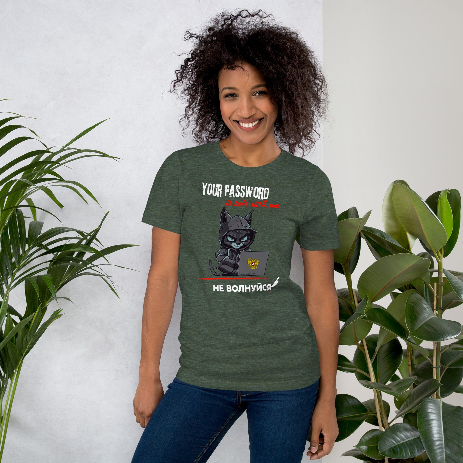 Woman wearing a green cotton t-shirt featuring a playful hacker cat graphic with the caption 'Your Password Is Safe With Me, Don't Worry!' in English and Russian, lightweight and comfortable fit.
