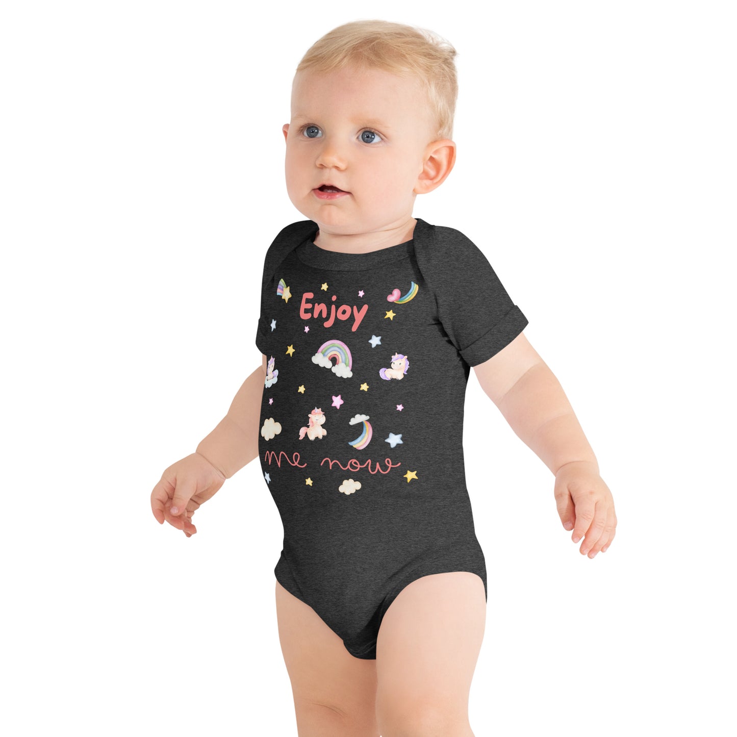 one piece cotton onesie for a baby with "Enjoy Me Now" caption and stars, rainbows, and unicorns