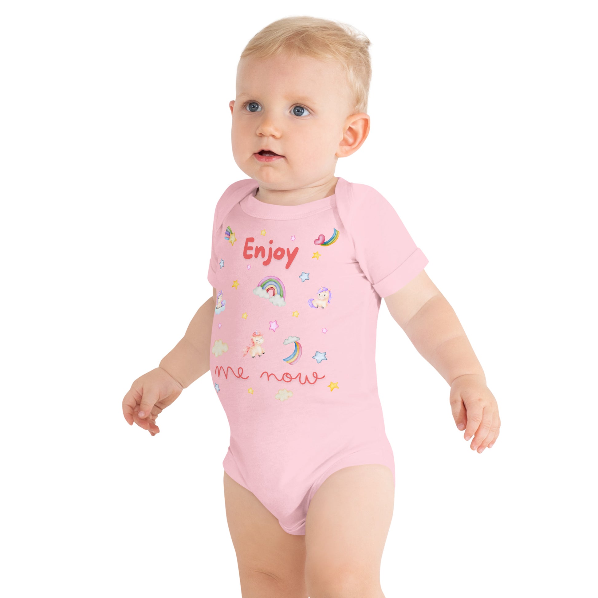 one piece cotton onesie for a baby with "Enjoy Me Now" caption and stars, rainbows, and unicorns