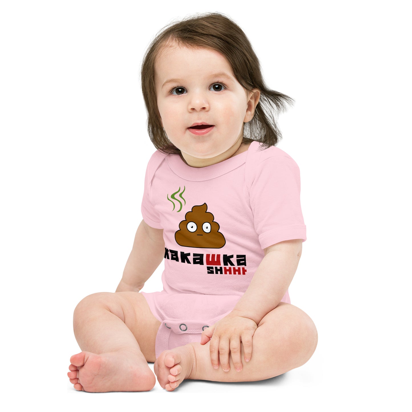 baby in pink one piece onesie with picture of poop and kakashka written on it