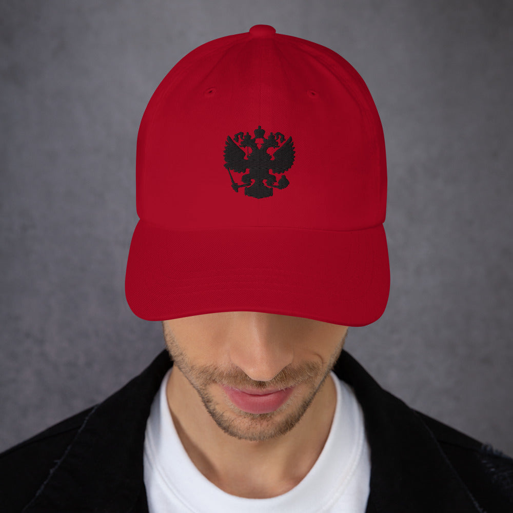 red cranberry baseball cap with black russian coat of arms embroidered in center