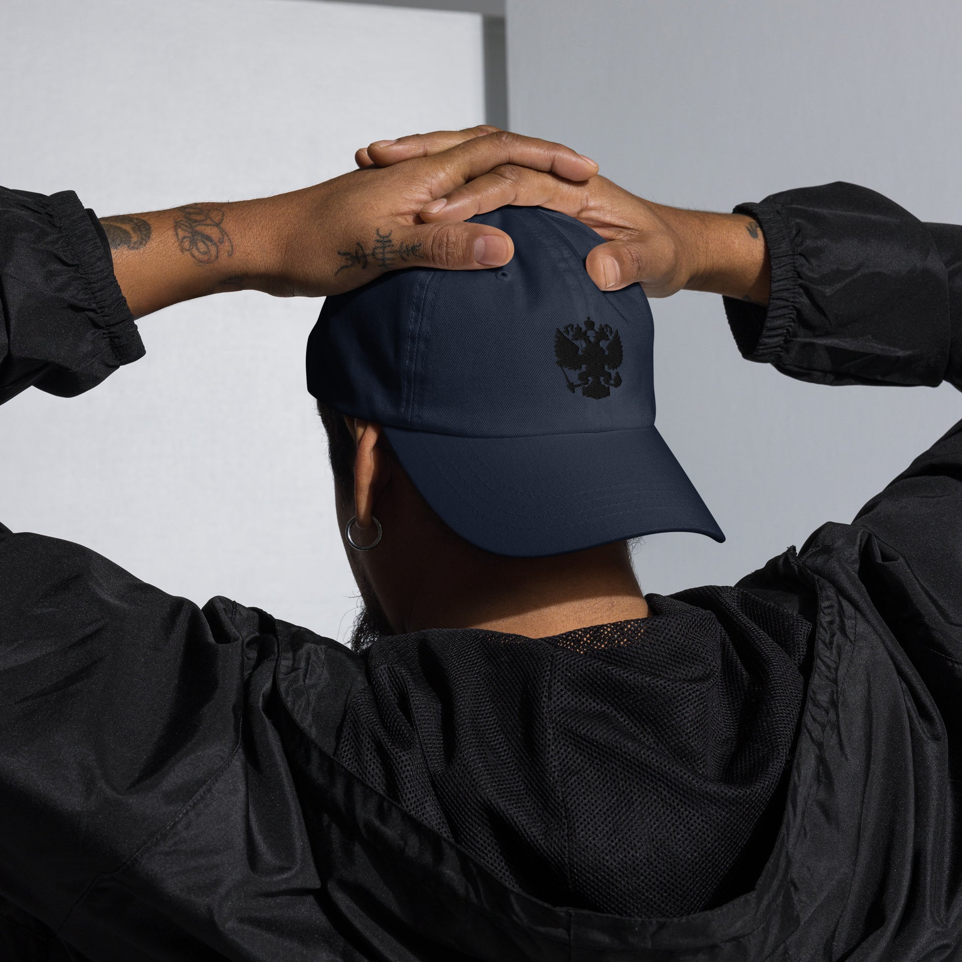 navy baseball cap with black russian coat of arms embroidered in center