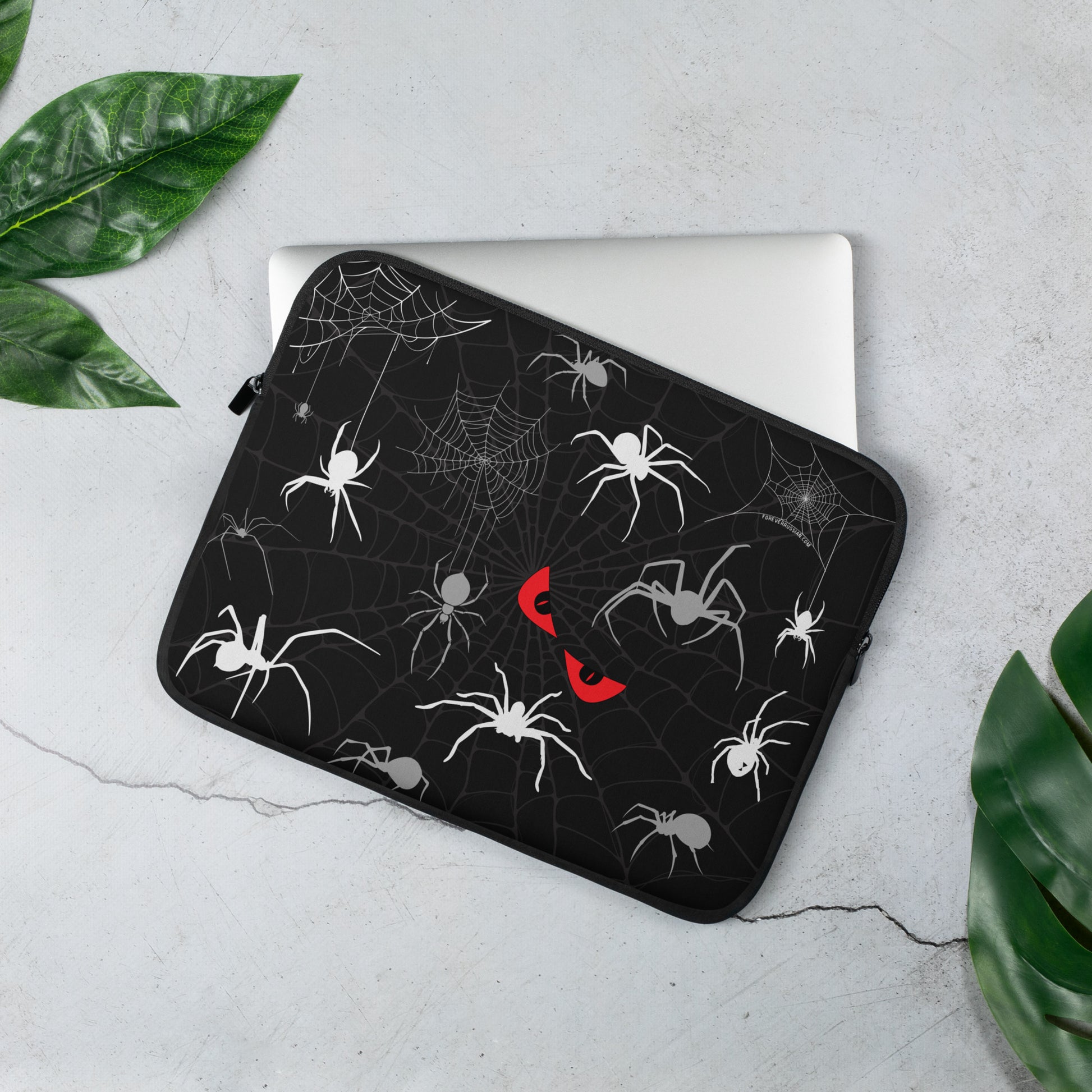 13 inch laptop sleeve with spiders, spider webs, and creepy red eyes. Perfect for Halloween.