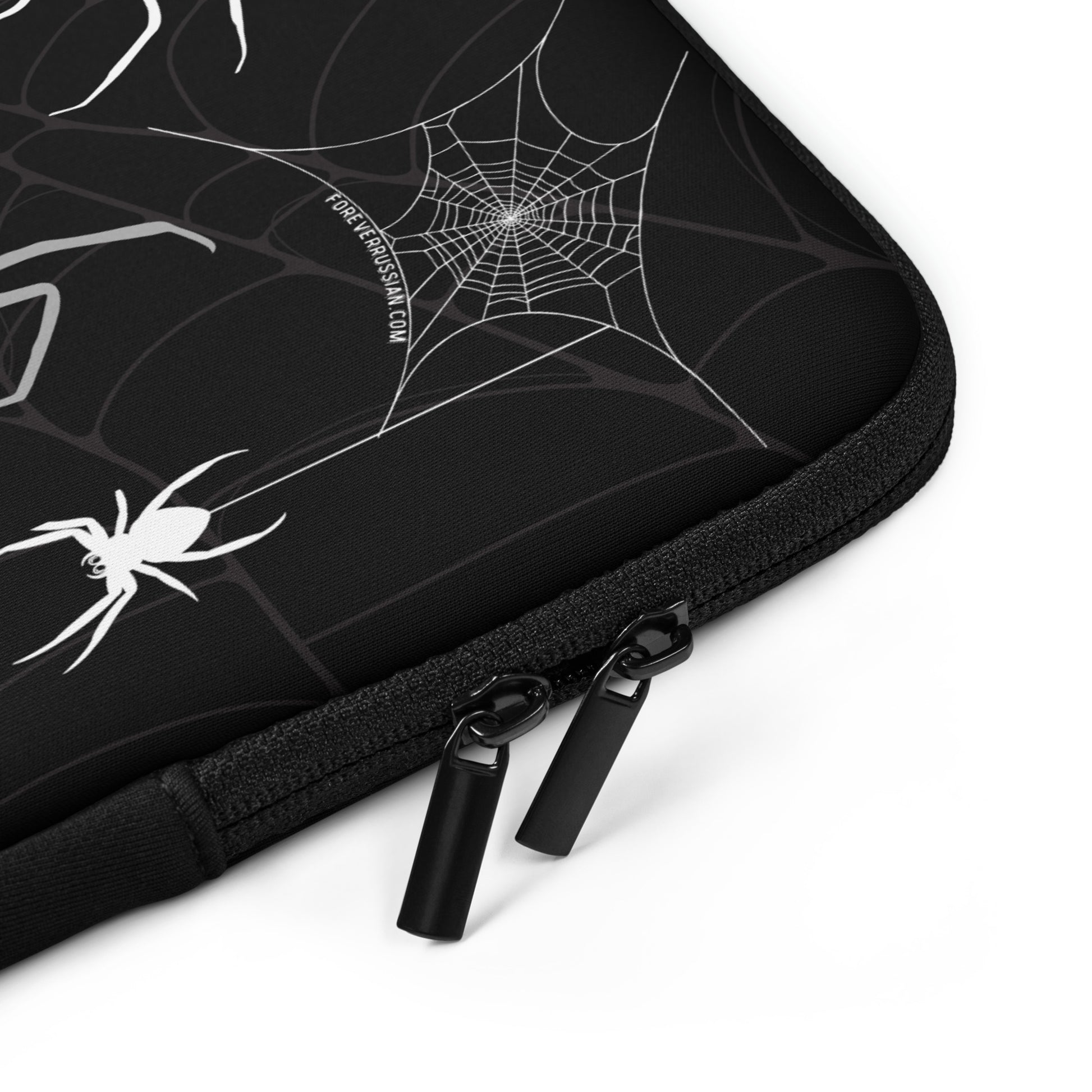 Laptop sleeve with spiders, spider webs, and creepy red eyes. Perfect for Halloween.