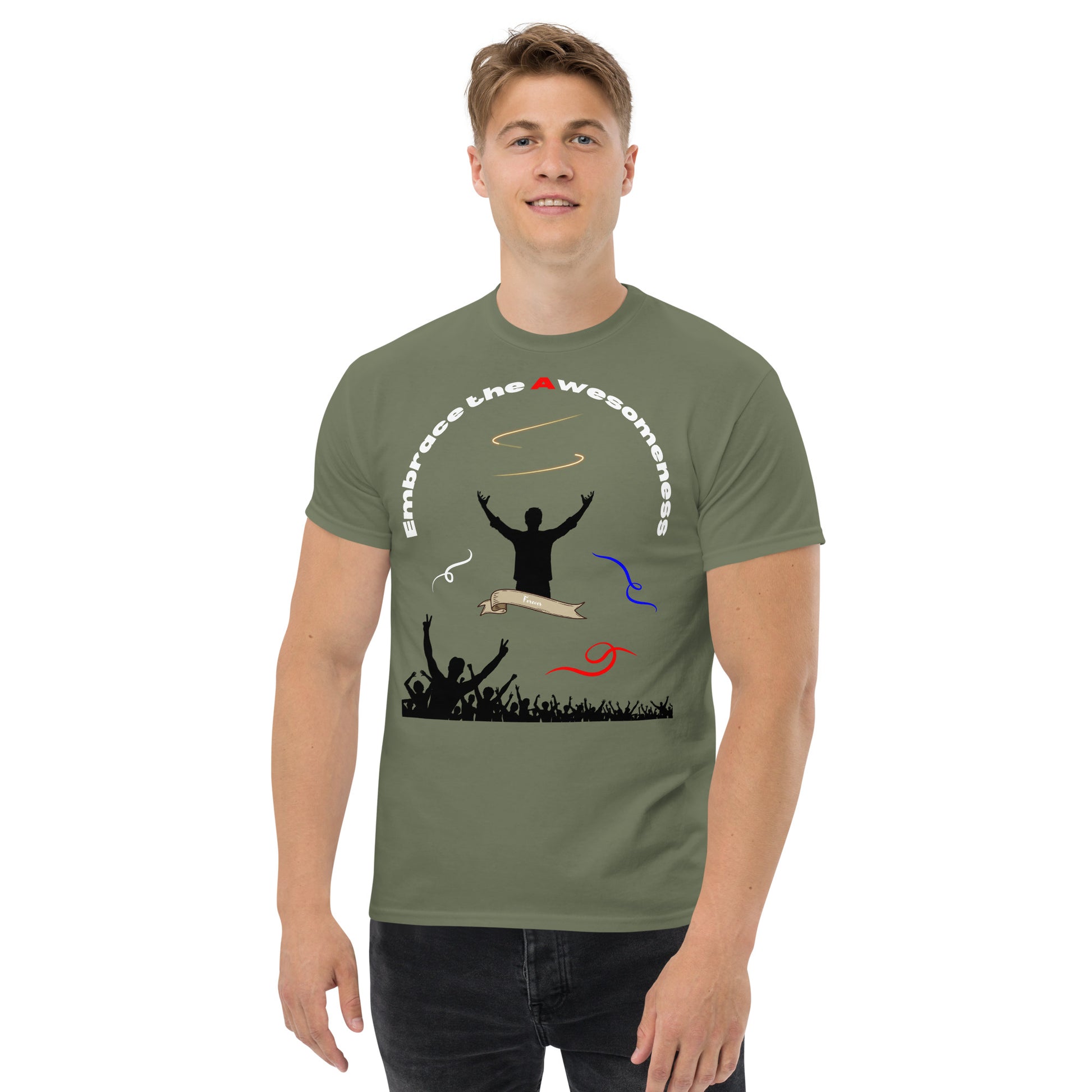 man in military green tshirt with words embrace the awesomeness inscribed in a half circle around a man with arms raised up you see whate blue and red colors featured and a crowd of people cheering in the background from the bottom