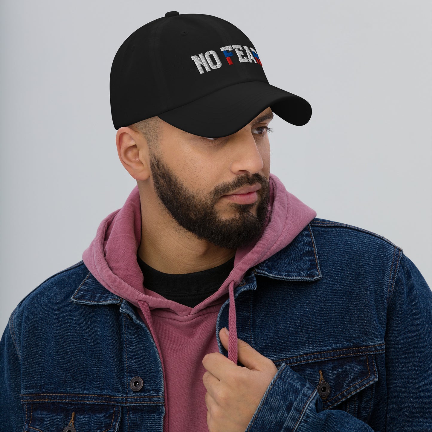 NO FEAR Russian streetwear cap styled with streetwear outfit, showing white, blue, and red embroidery.