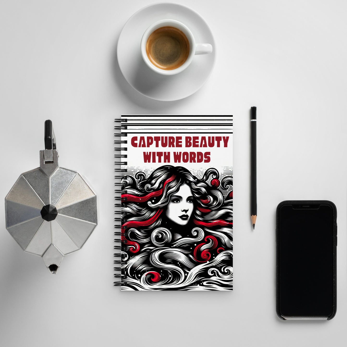 Spiral notepad with caption "Capture Beauty With Words" and a sketch of a beautiful woman in black, white, and red colors.