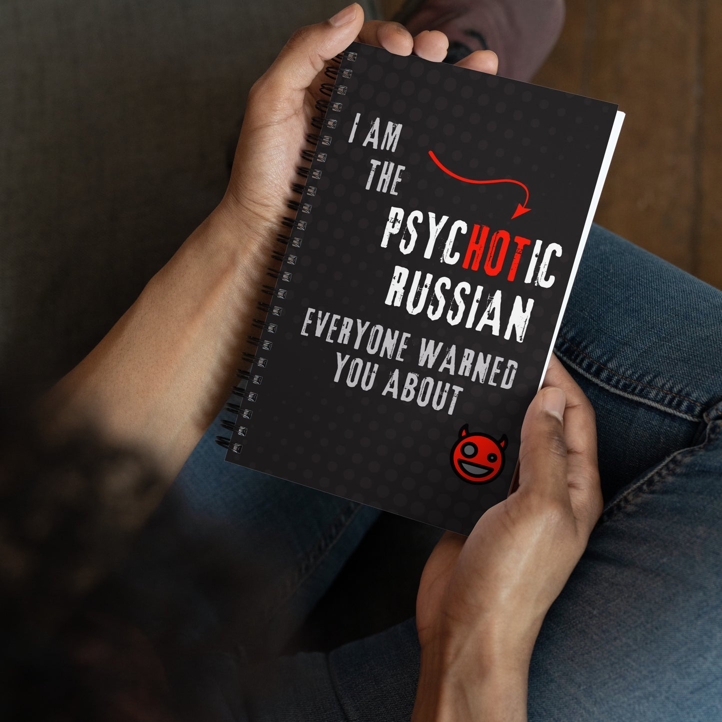 Spiral notepad with text 'I Am the Psychotic Russian Everyone Warned You About' and red devil graphic.