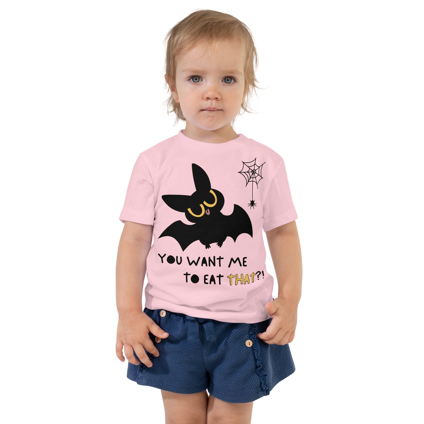 Toddler in a pink cotton t-shirt with a cute bat next to a spider hanging off a spiderweb and caption "You Want Me To Eat THAT?!"