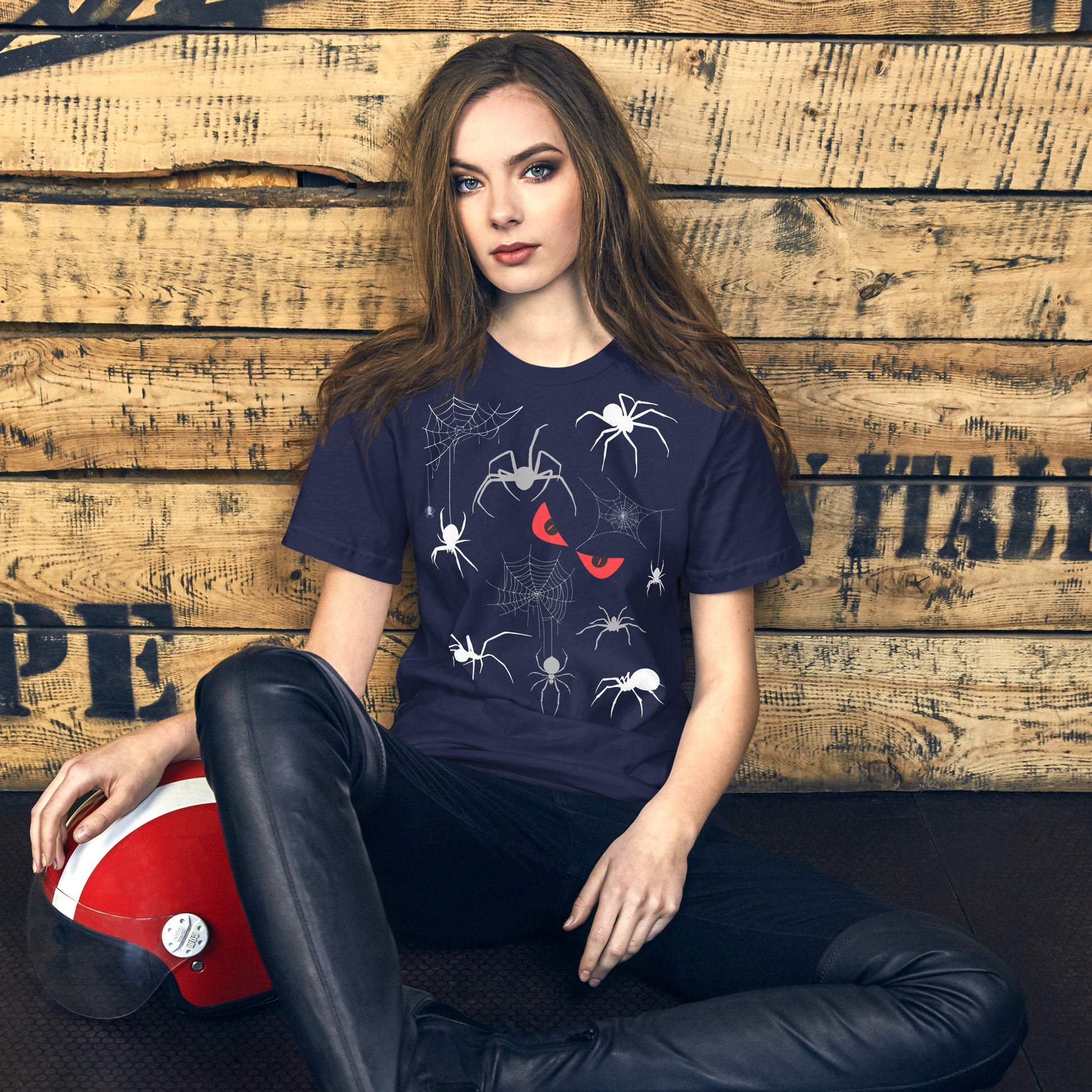 Woman in a unisex navy blue t-shirt with creepy spiders, spider webs and malicious red eyes. 