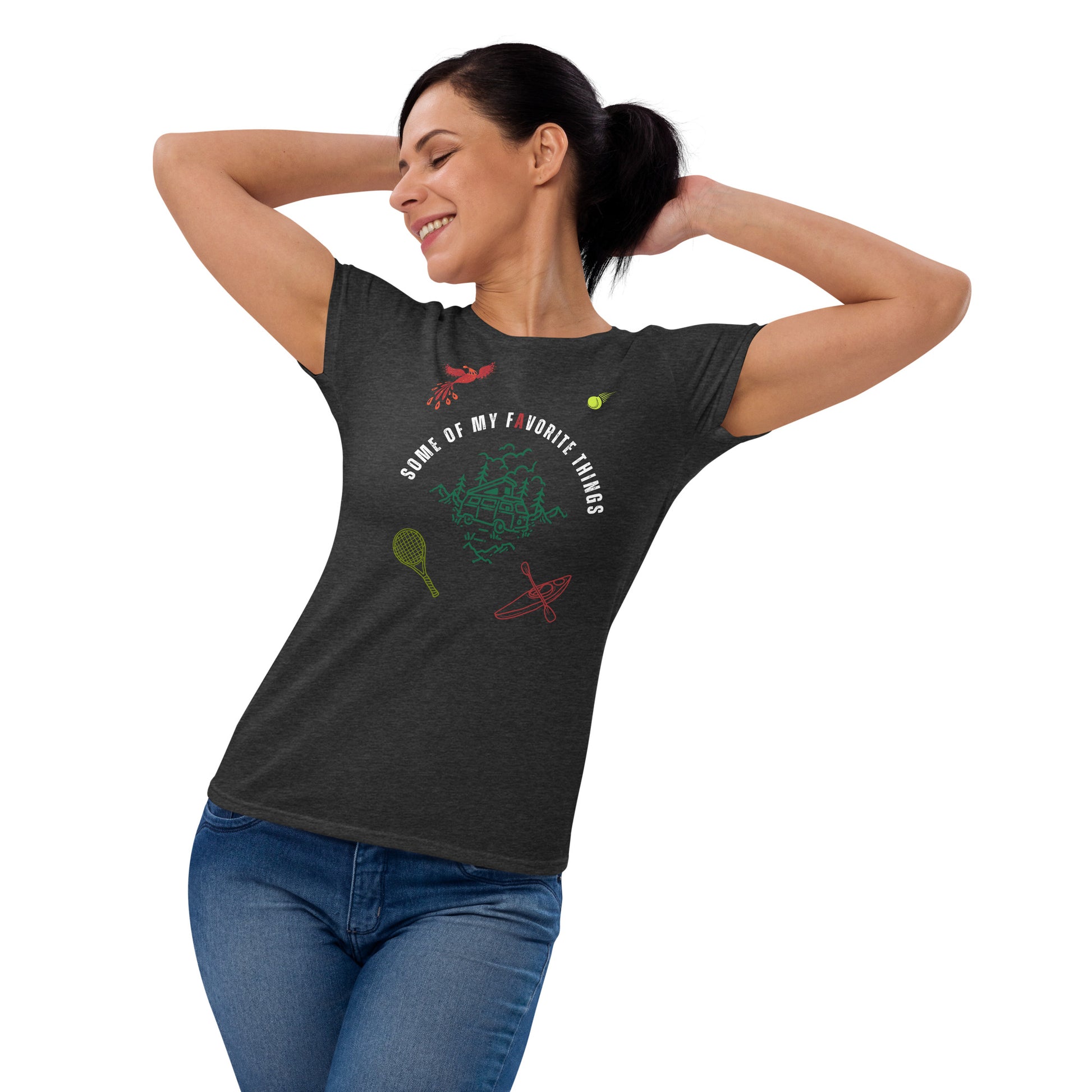 woman in dark dark heather grey t-shirt with some of my favorite things inscribed in the center, russian firebird, tennis ball, tennis racket, kayak, camper van, nature scene