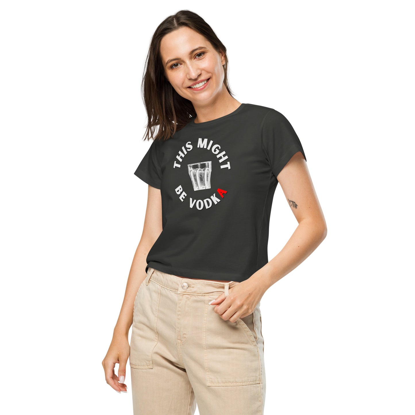 woman in vintage black tshirt with this might be vodka inscribed around a cup with fluid the letter A on the image is colored red